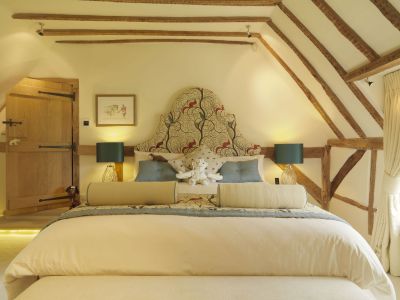 bedroom with a mix of new and old using lamp light and modern led lighting to bring warmth