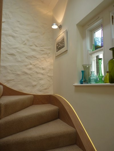 specially built led lighting to excenuate rustic features in a listed building